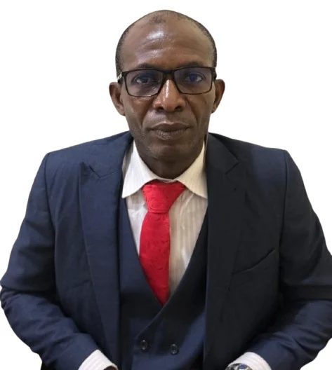 view of a coastal Mediterranean village on a hillside, with small boats in the water.