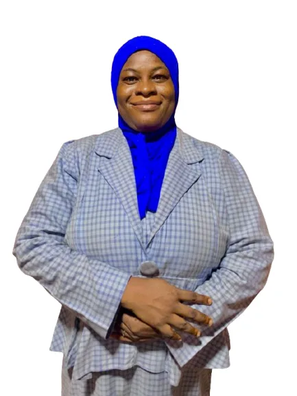 view of a coastal Mediterranean village on a hillside, with small boats in the water.